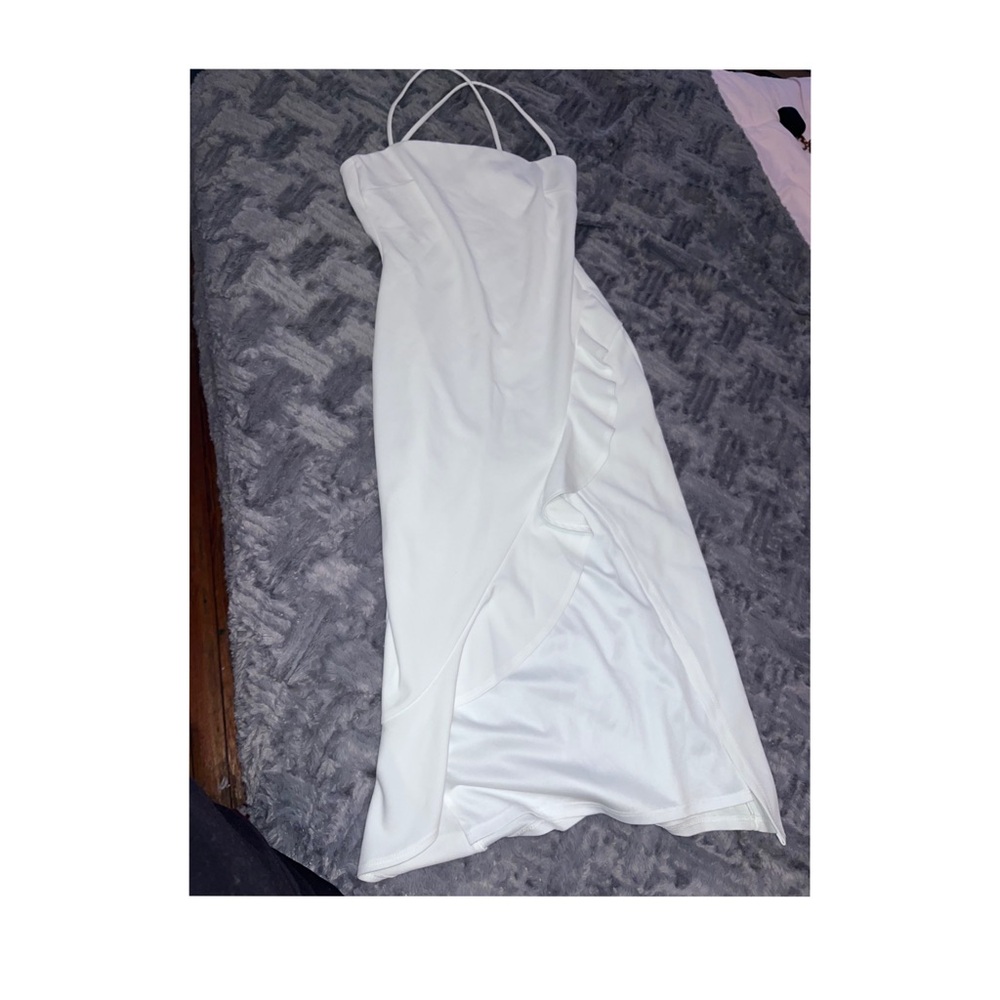 White dress with slit and ruffles